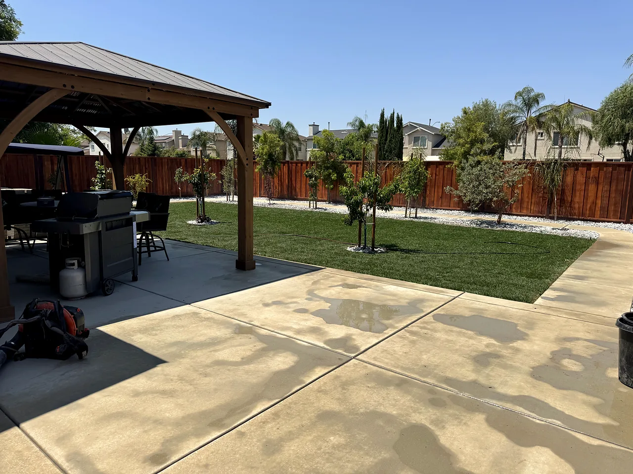 The new concrete patio and gazebo looking out over the lawn