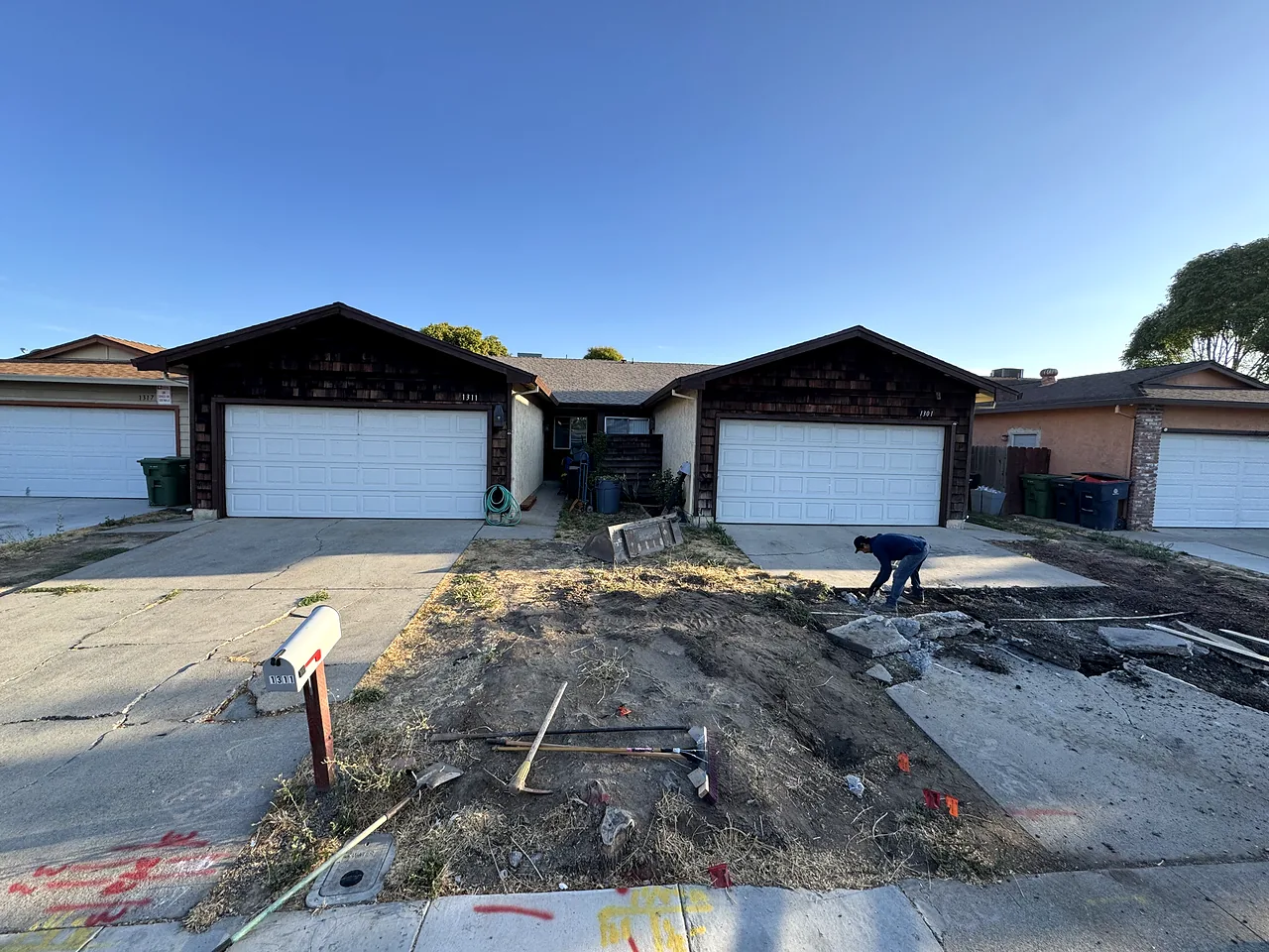 Duplex front during tear-out, old surface removed and forms going in