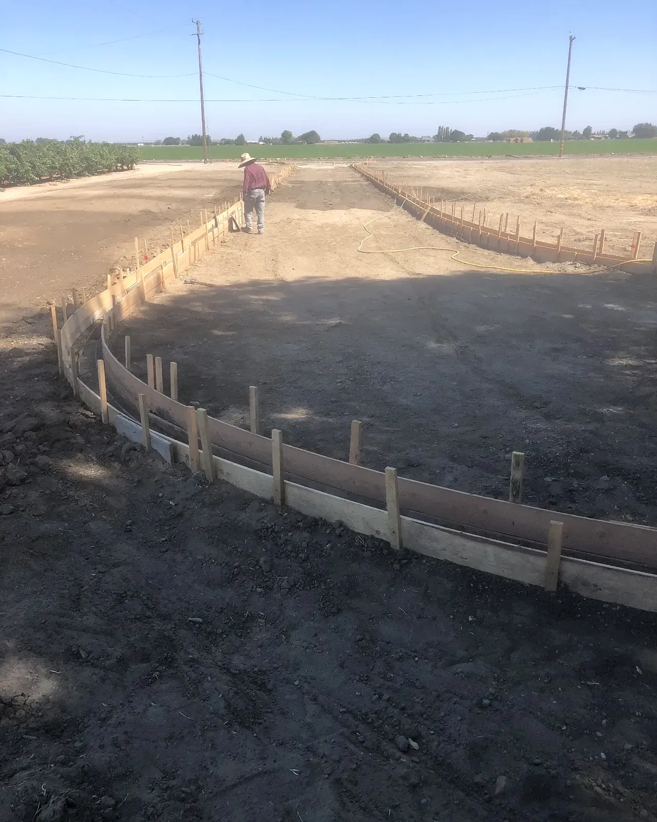 Bare dirt with forms set for concrete borders