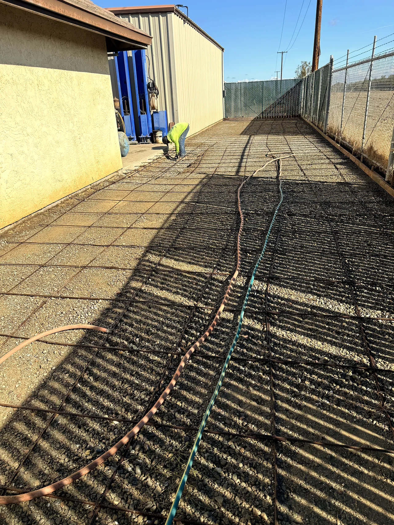 Rebar grid tied and set along the house before the concrete pour